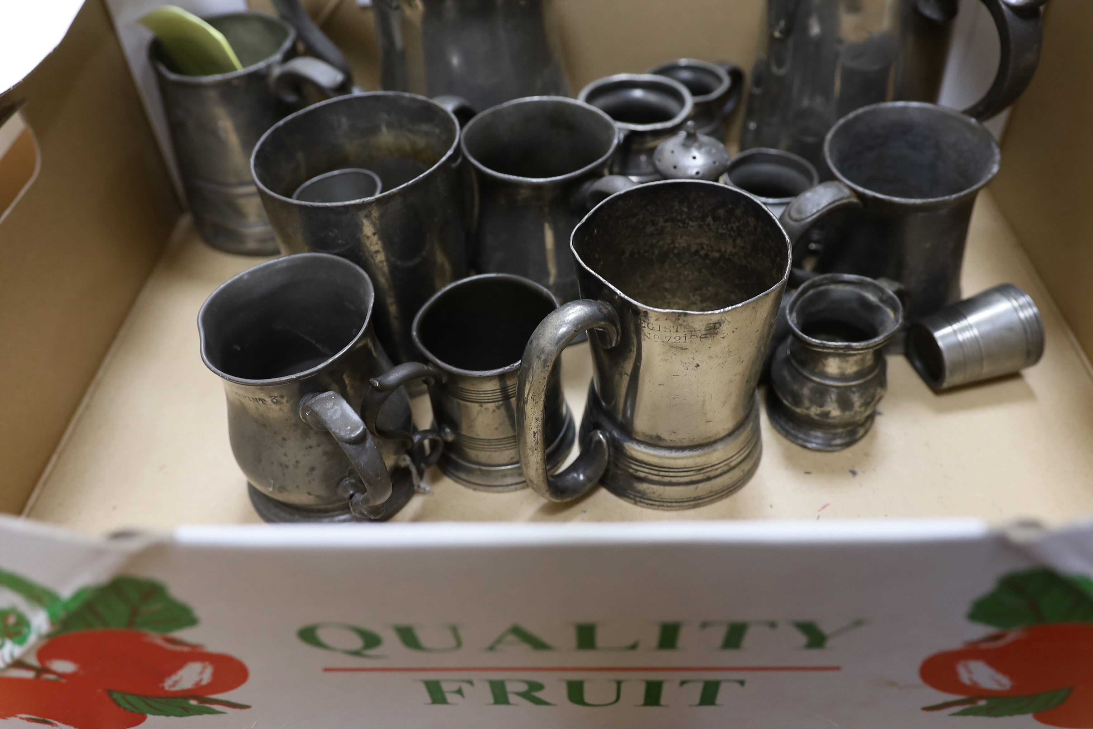 A collection of pewter mugs and measures including, The New Green Man Pub, Watford 1730, The Two Brewers, St Albans 1792 and The Lower Red Lion St Albans 1767, j tallest item 17cm high